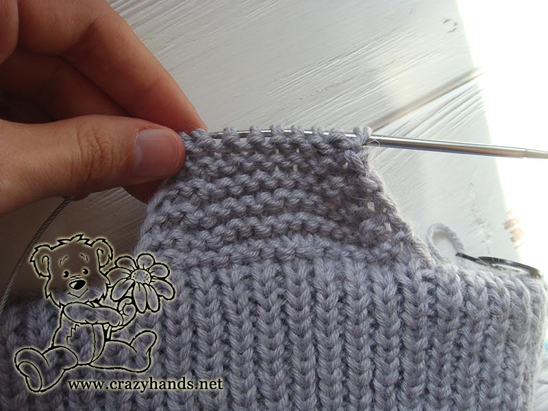 knitting the ear flaps of the baby hat - step three