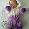 Baby in Knit Romper with Cables (photo two)
