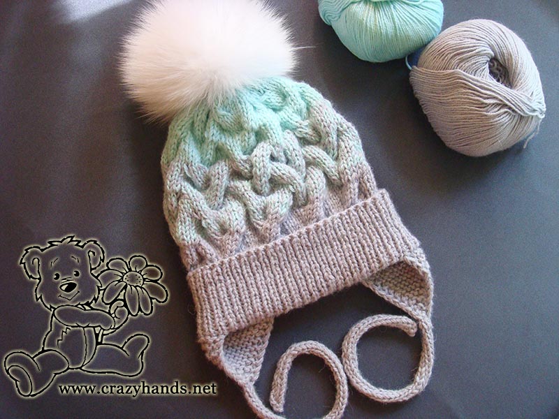 knit baby hat with fur pom pom
