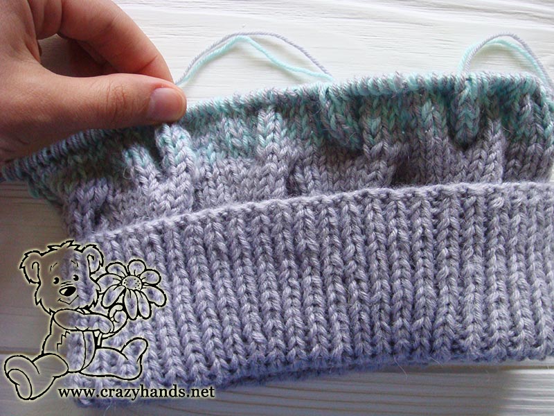 half-finished body of the baby hat with folded brim