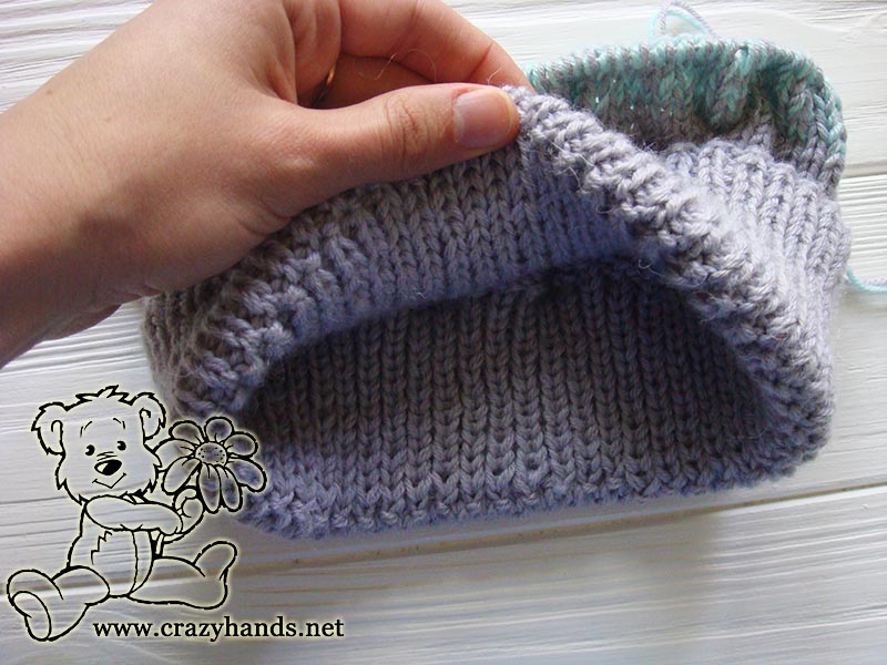 inside look of the folded brim of baby knit hat