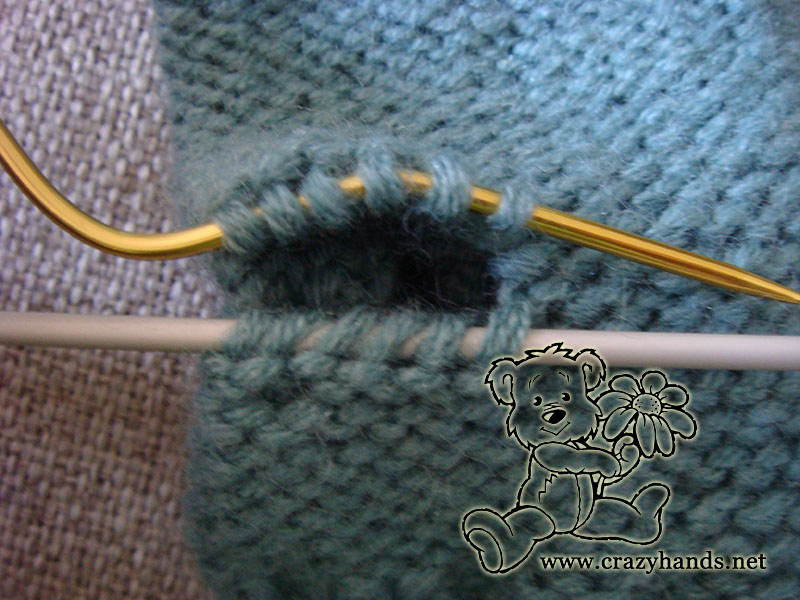 knitting the thumb of fingerless cable gloves - step two