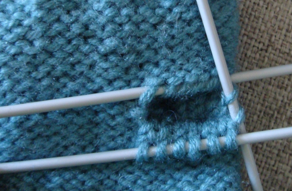 knitting the thumb of fingerless cable gloves - step three