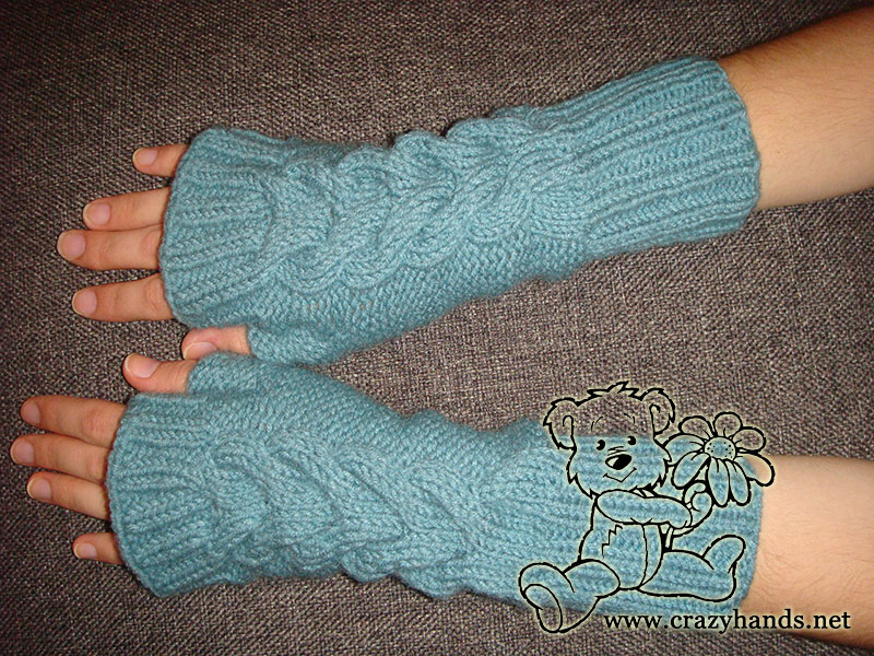 woman wears fingerless gloves - cables side