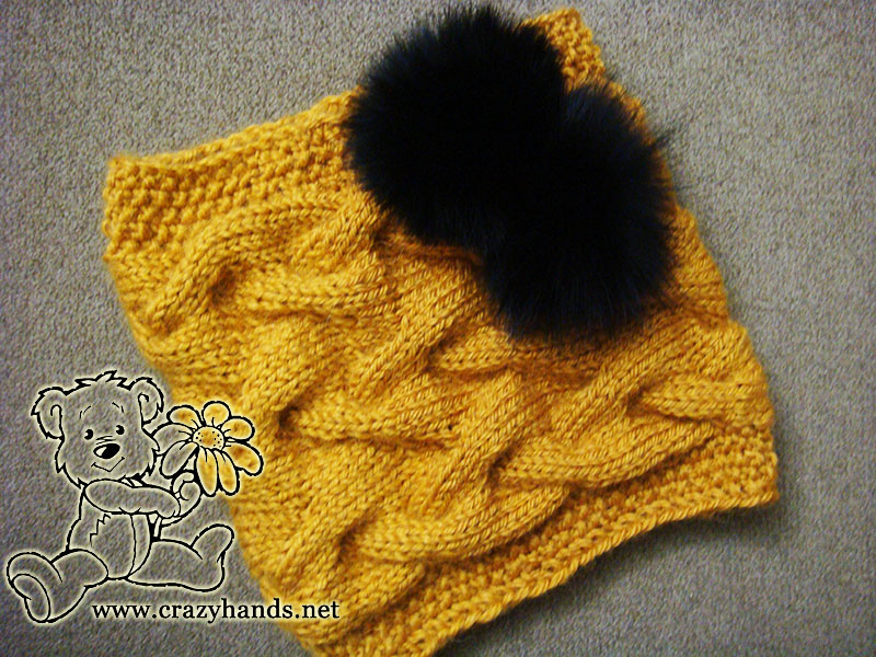 cable knit cowl with two fur pom poms