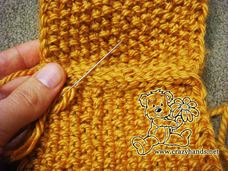 sewing together both edges of the seed stitch knit headband