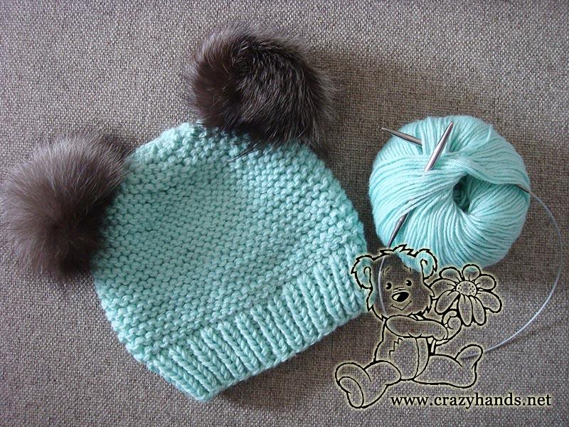 ocean blue baby knit beanie with two silver fox fur pom pom