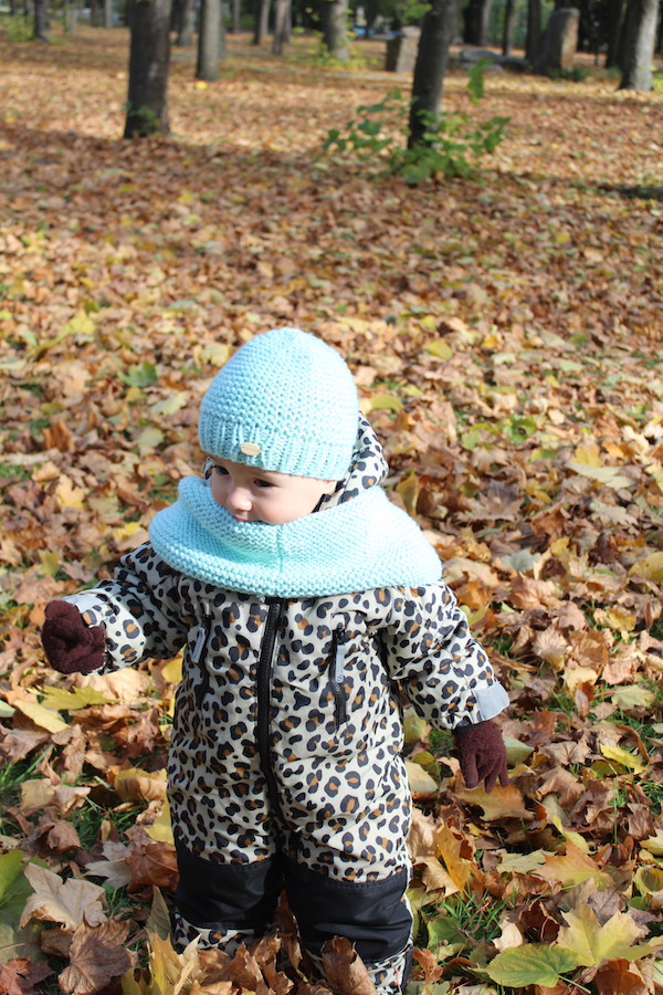 baby wears ocean blue knit baby hat