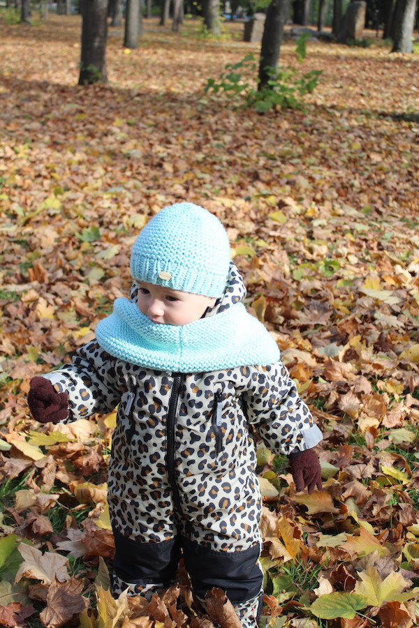 baby boy wears an infinity knit scarf and knit hat set