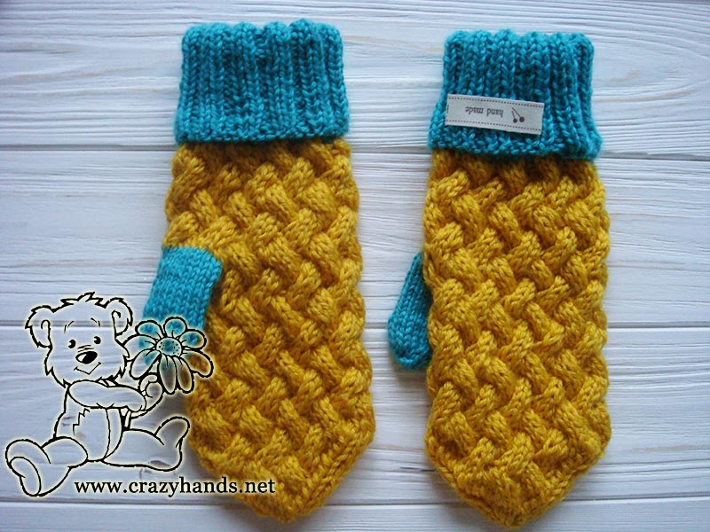 a pair of mittens knitted on the straight needles