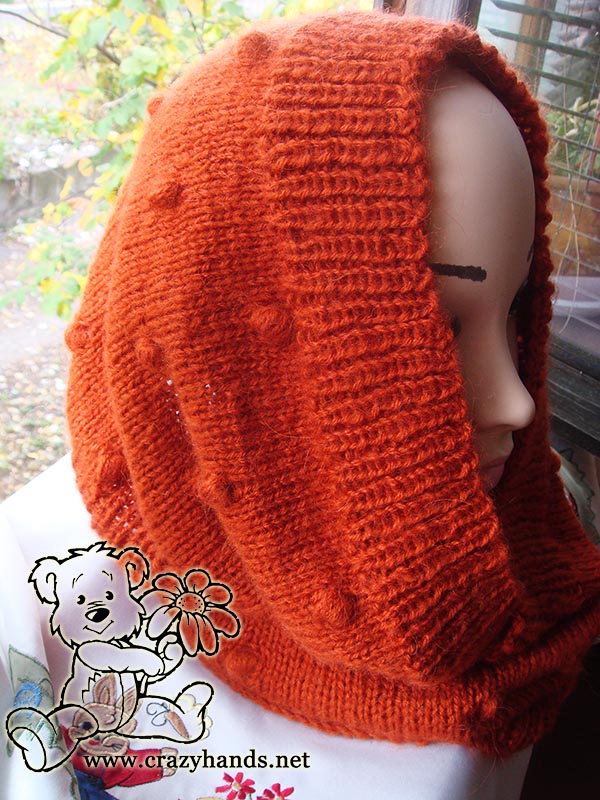 orange knit cowl with bobbles on the mannequin - hooded cowl style - right side view