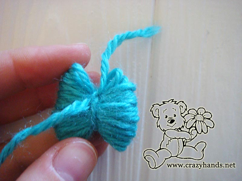 making mini yarn pom pom - step two