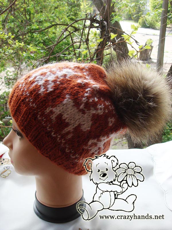 knit reindeer slouchy hat with fur pom pom on the mannequin's head