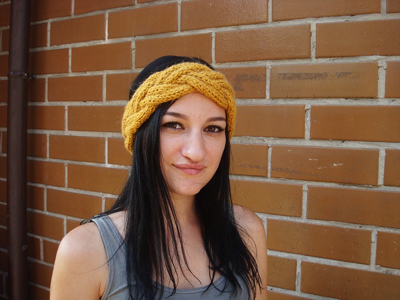 female model wears a bulky braided headband