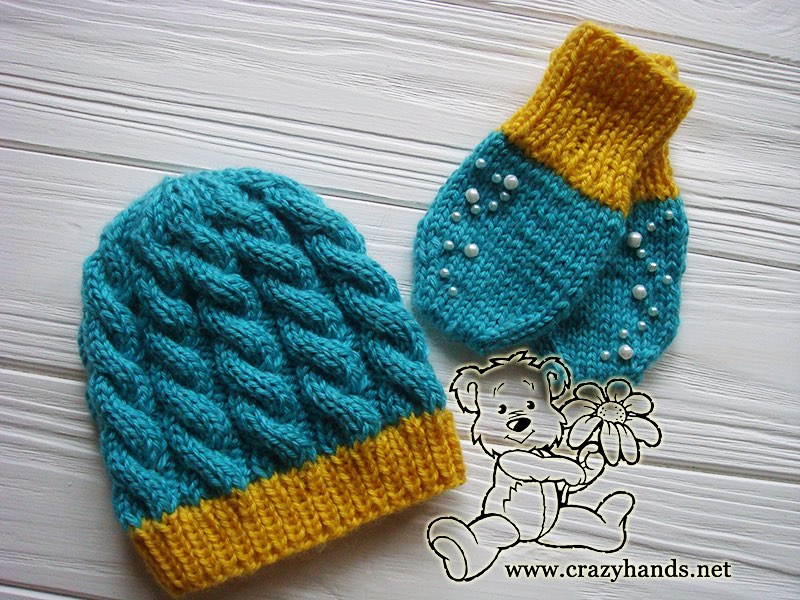 newborn baby knit hat and thumbless knit mittens with embroidery made with blue and yellow yarn