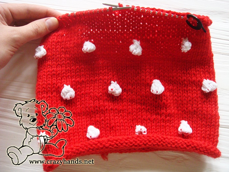 half-finished slouchy knit santa hat with bobbles