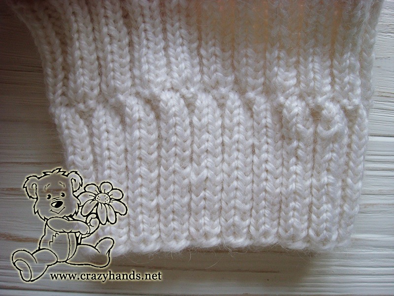folded brim of marshmallow cable knit hat