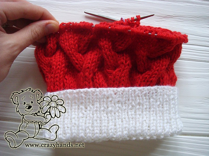 half-finished baby santa cable knit hat