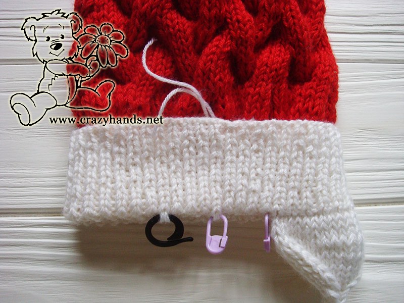knitting right earflap of the baby santa cable hat