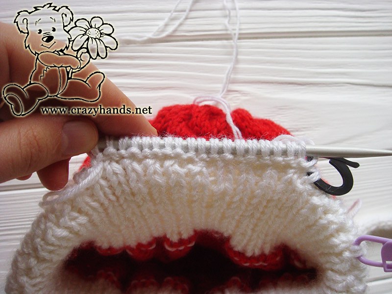 knitting earflap of baby santa cable hat - step three
