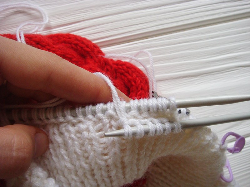 knitting earflap of baby santa cable hat - step six