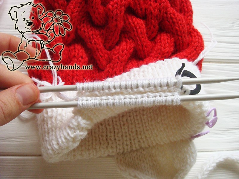 knitting earflap of baby santa cable hat - step seven