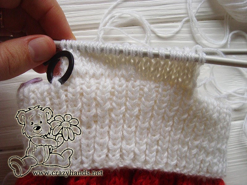 knitting earflap of baby santa cable hat - step eight