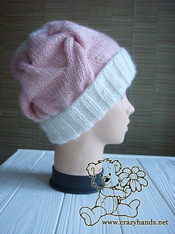 pink marshmallow cable knit hat on the mannequin - right side view
