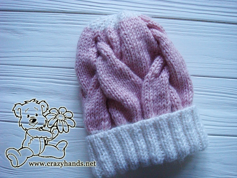 pink marshmallow cable knit hat with white crown and white brim