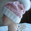 pink marshmallow cable knit hat with fur pom on the mannequin - left side view