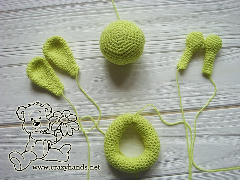 separate pieces of crochet bunny ring rattle