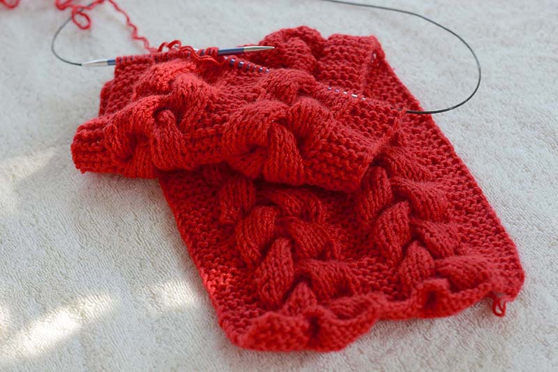 half finished santa baby knit scarf