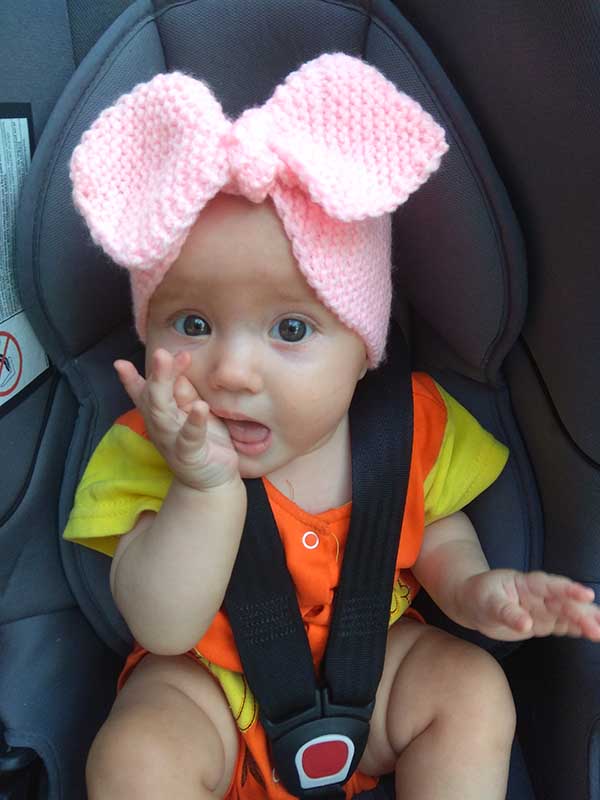 baby girl wears bow knit headband