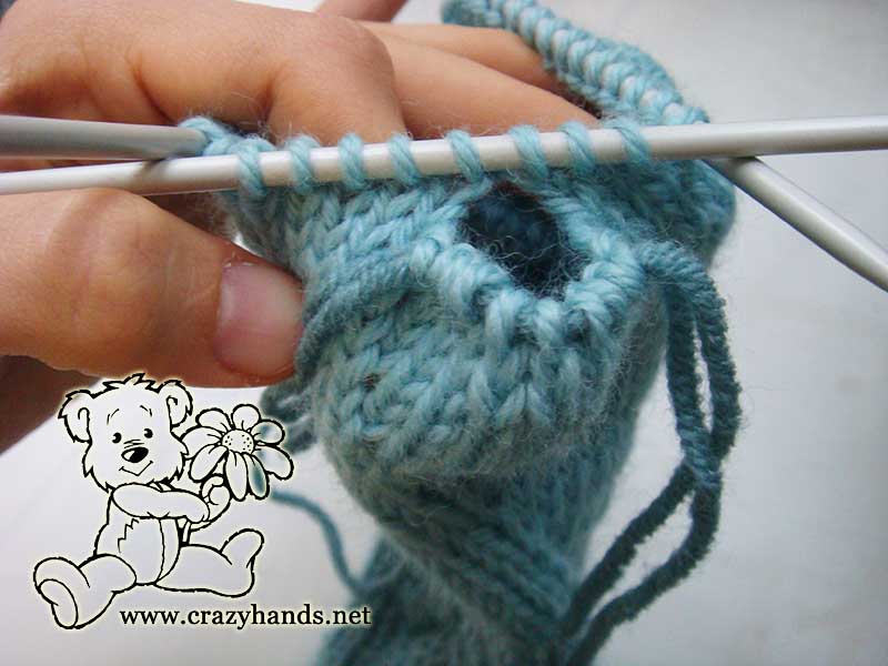 gusset section of long knit fingerless glove