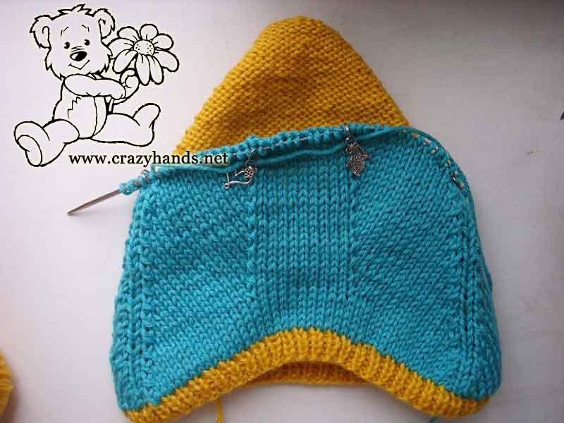 half-finished outer layer of knit baby pixie hat - back part