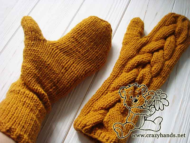 long mustard knit cable mittens - one face up and another one bottom side up