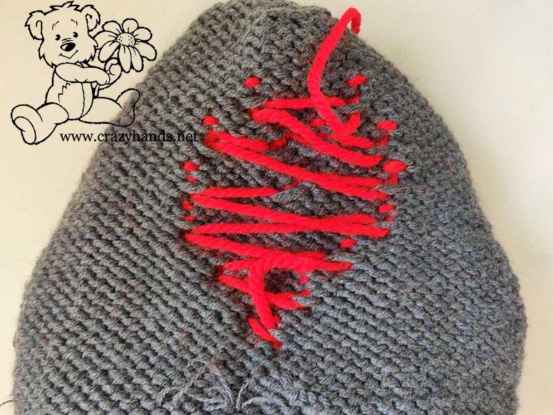 red heart knit baby beanie pattern - backside view of the bobbles