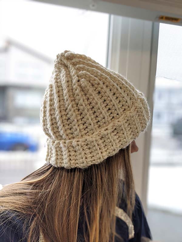 woman model wears a super bulky crochet hat