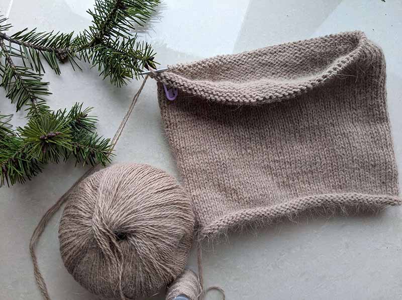 half-finished stockinette stitch knit beanie