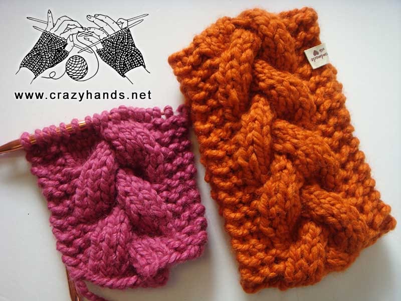 two bulky cable headbands - one finished and assembled in orange yarn, the other one is half finished using violet super bulky yarn
