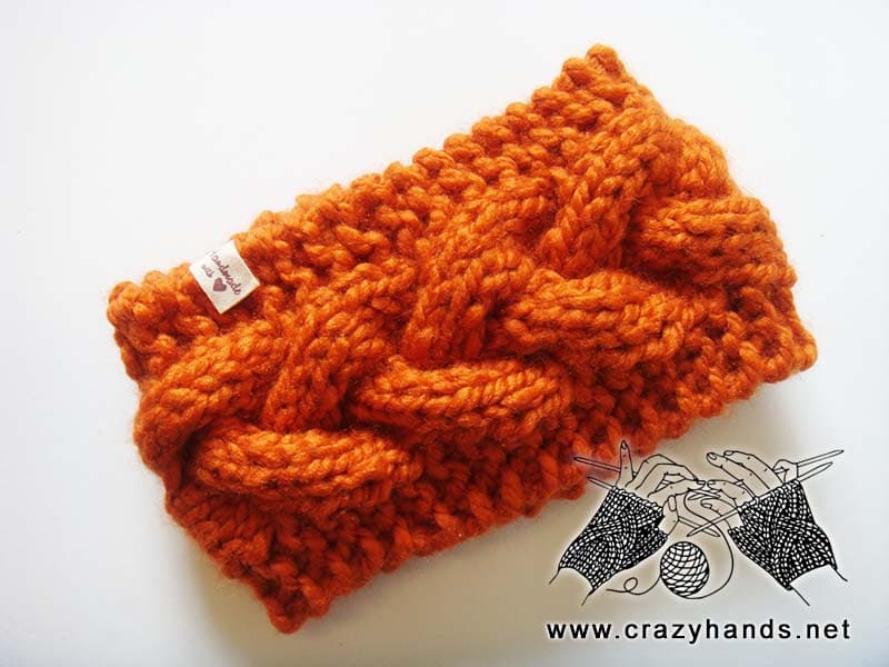 bulky braided knit headband made with orange yarn