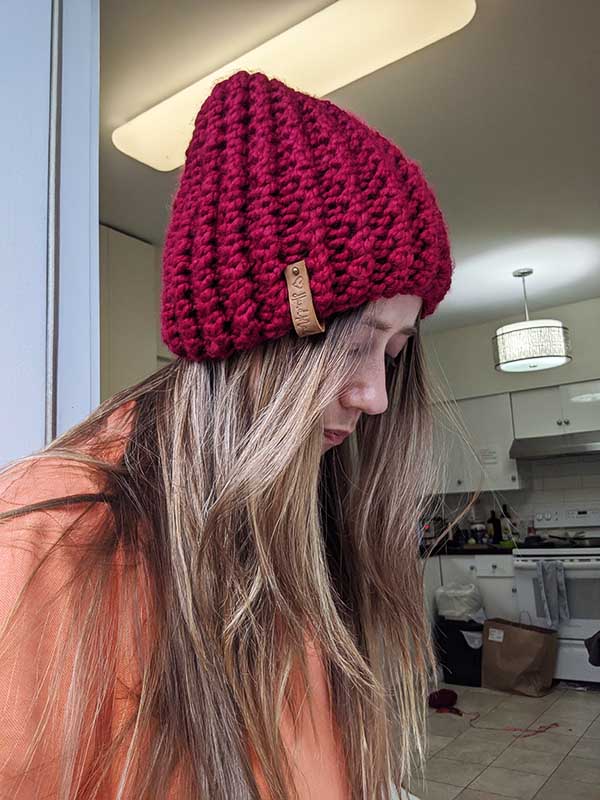 woman model wears a bulky bubble ribbed knit hat 