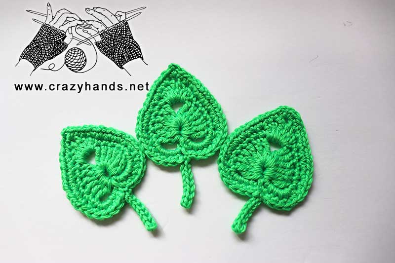 arrangement of three crochet lilac leaves made with green acrylic yarn