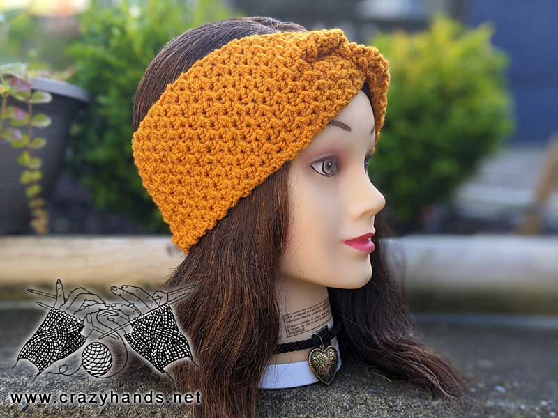 phoenix crochet ear warmer on mannequin head - left side view