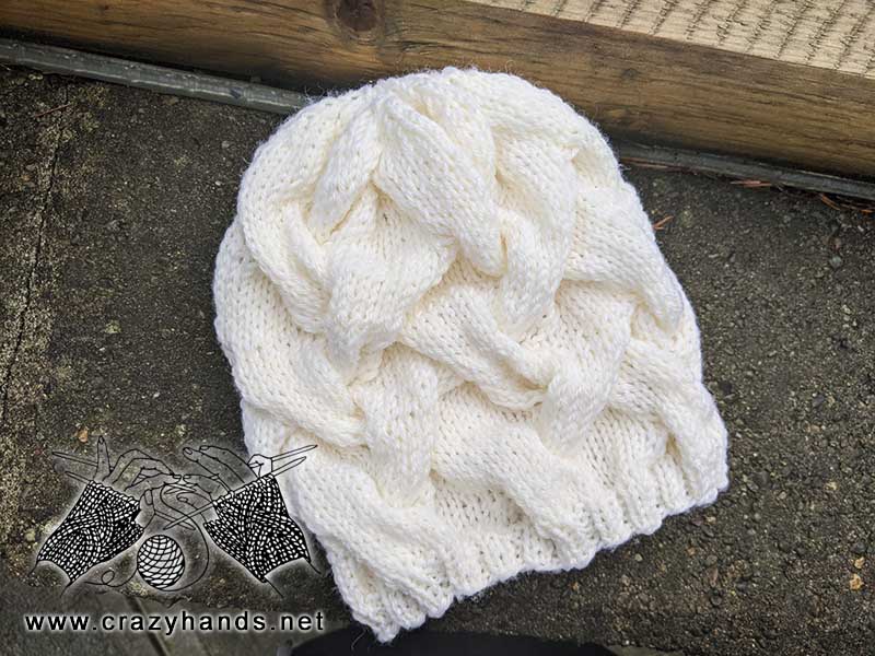 selene cable knit beanie made with white yarn