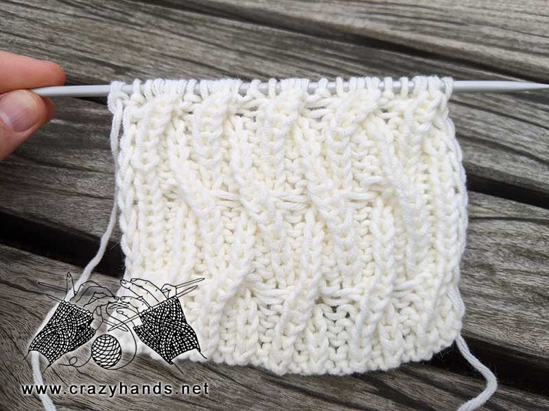 liana cable knit stitch for hats made with white yarn