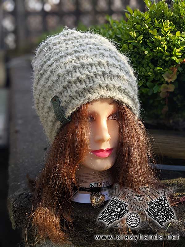 misty moss knit beanie on mannequin head - front side view