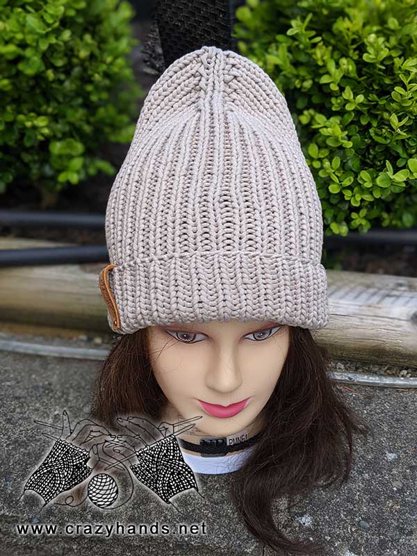 dove ribbed knit hat on the mannequin's head