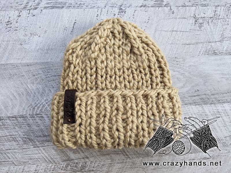 Knit hat with double brim made using super bulky yarn of light brown color
