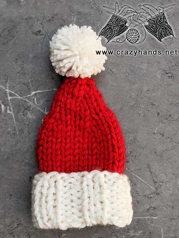 knit mini santa hat with yarn pom pom